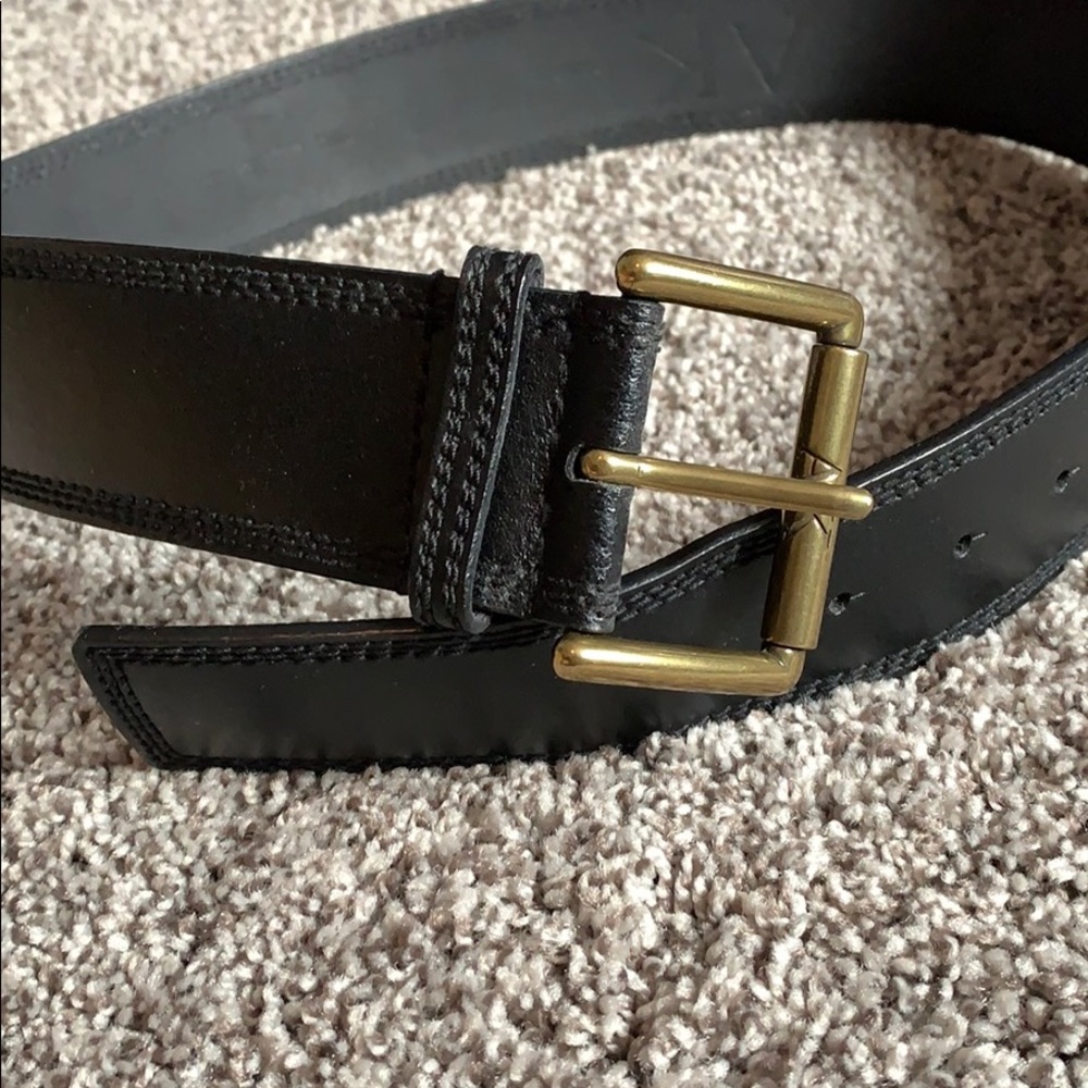 Black leather belt with gold buckle